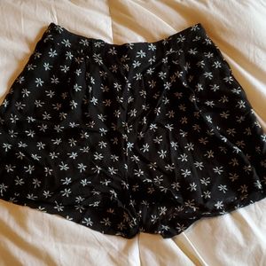 Black shorts with green palm trees